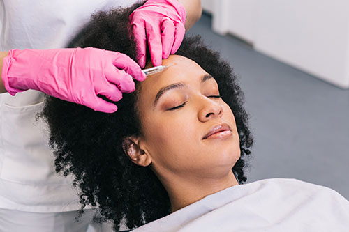 Woman getting filler treatment