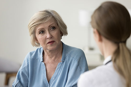Older woman speaking with doctor