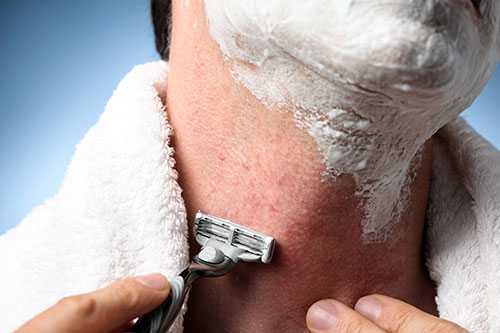 man shaving neck